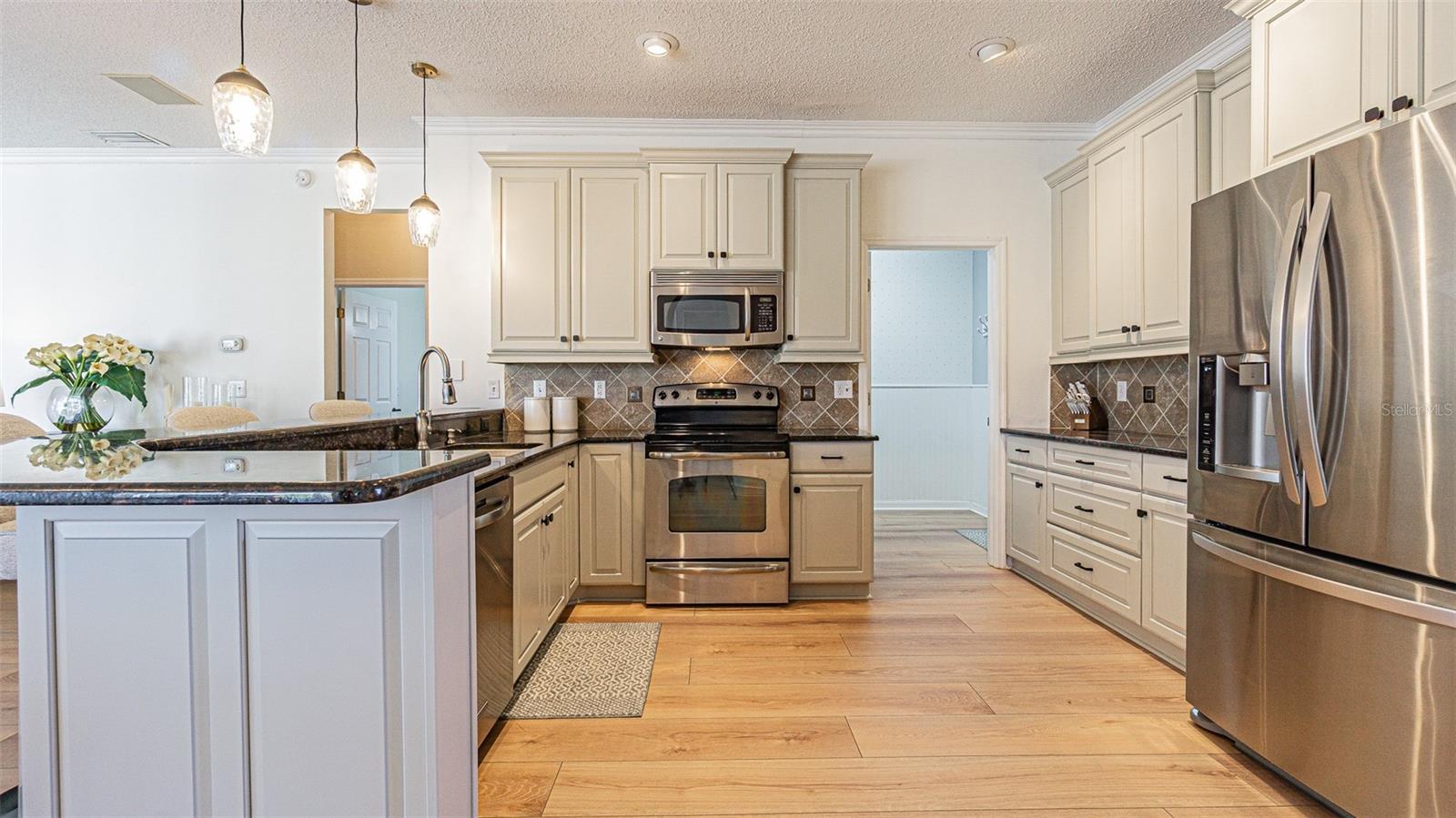 Large kitchen with stainless appliances