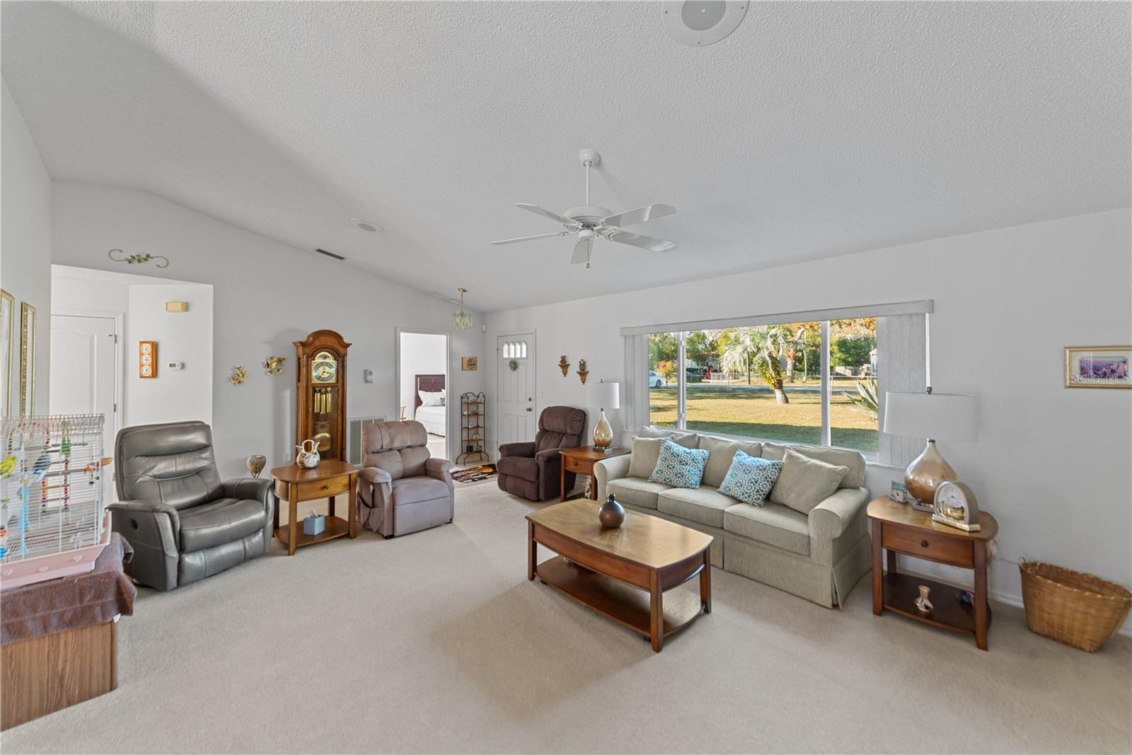 Welcome to this bright and open floorplan which is meticulously maintained. Vaulted ceilings, hurricane-grade front window