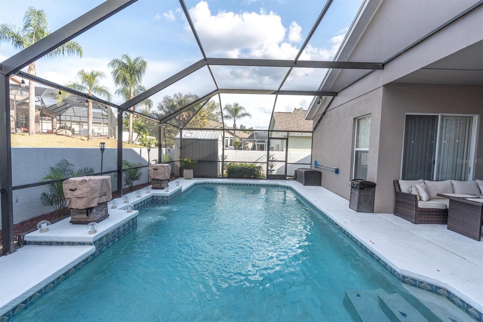 Enclosed Pool with Dual Firepits and Automated Functionality