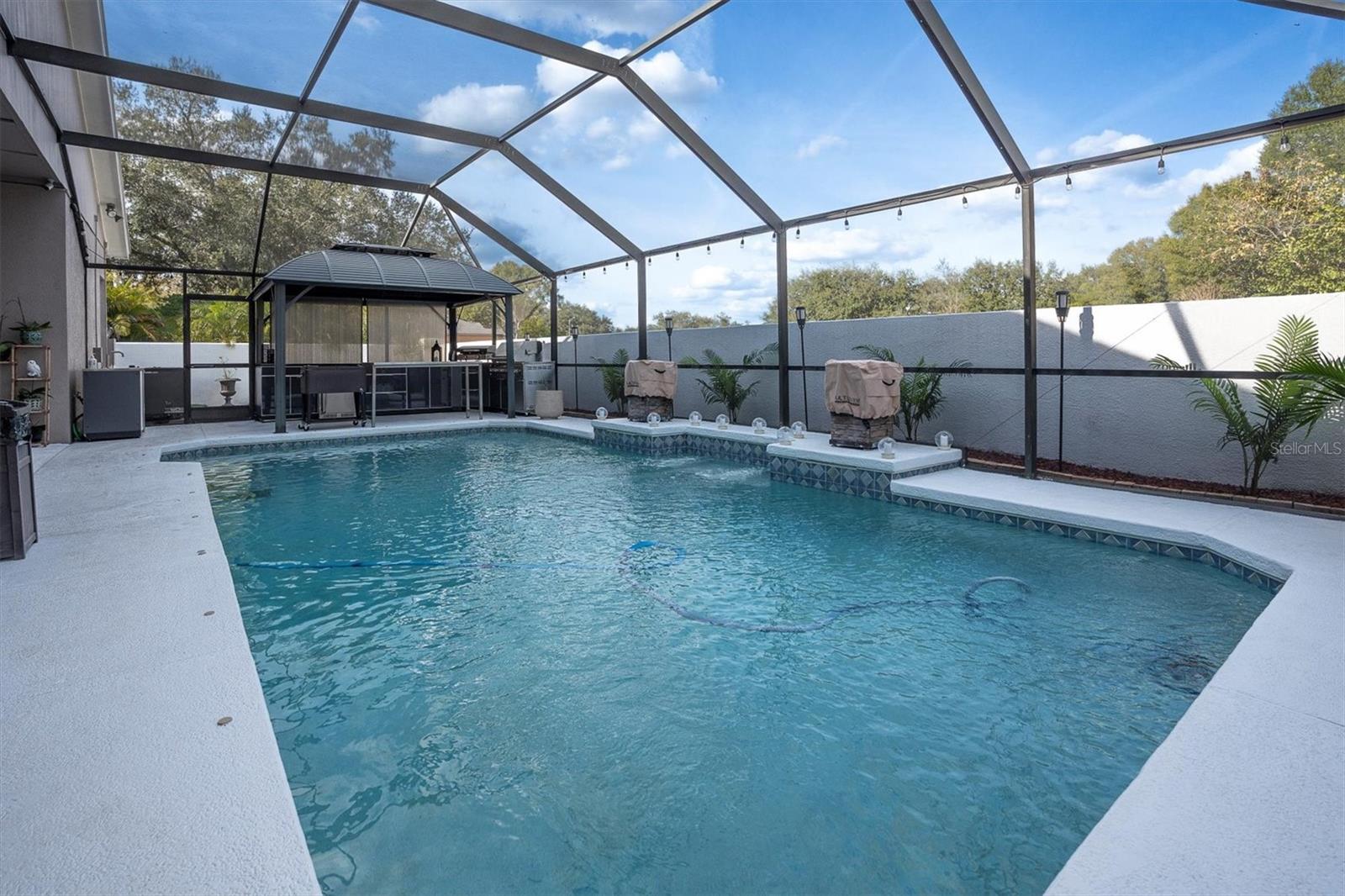 Enclosed Pool with Dual Firepits and Automated Functionality