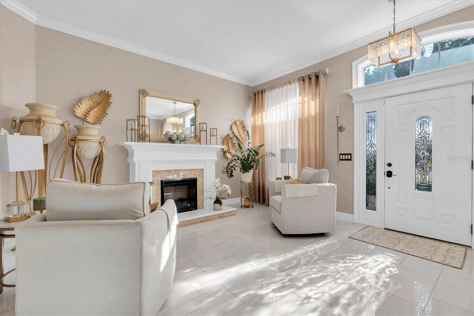 Formal Living Room with Fireplace and Custom Mantle.