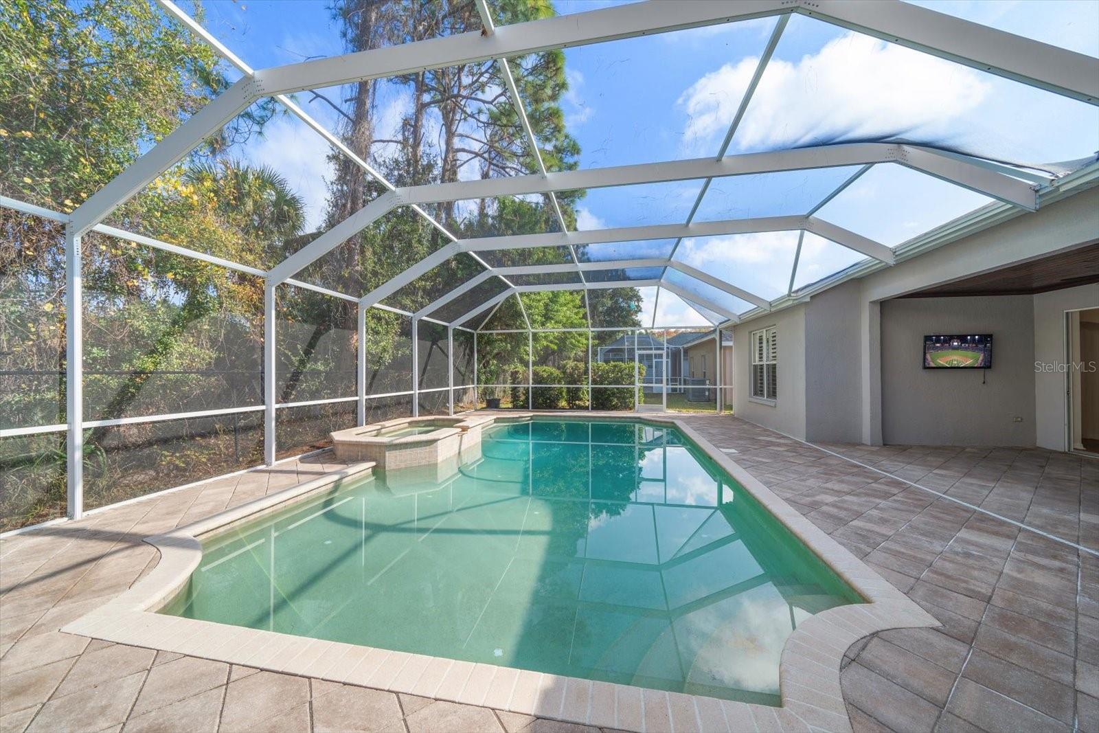 Pool with spacious patio & screened enclosure