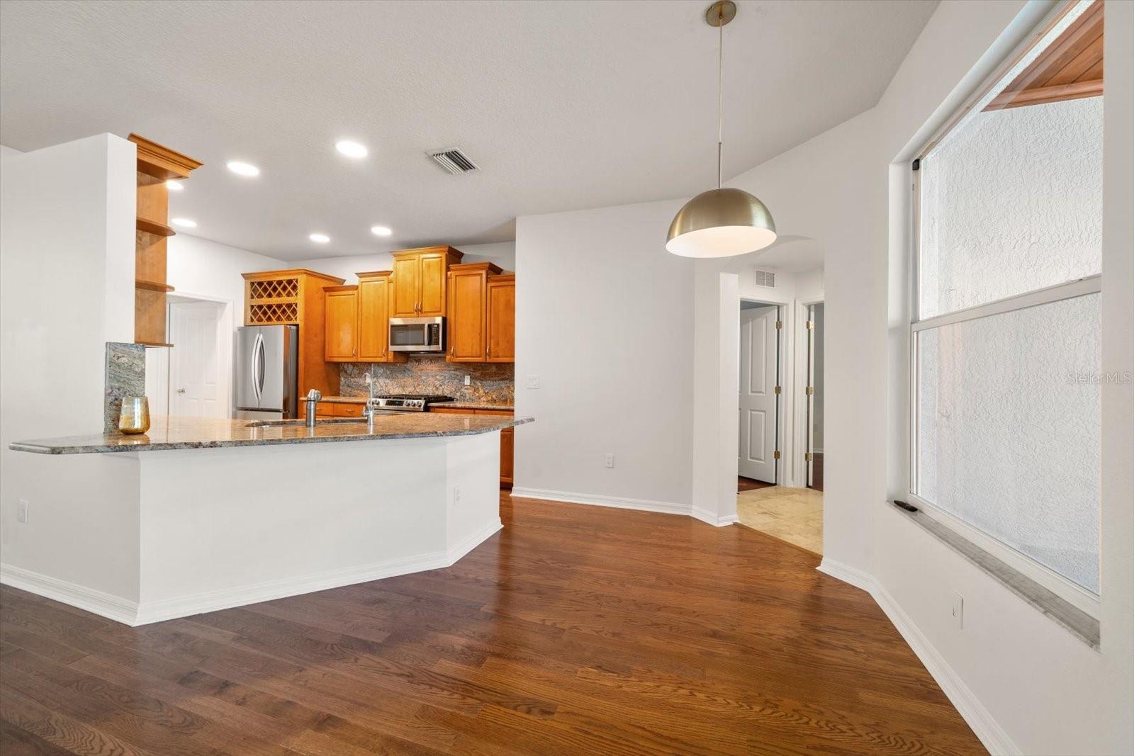 Family Room view looking to kitchen & eat in space