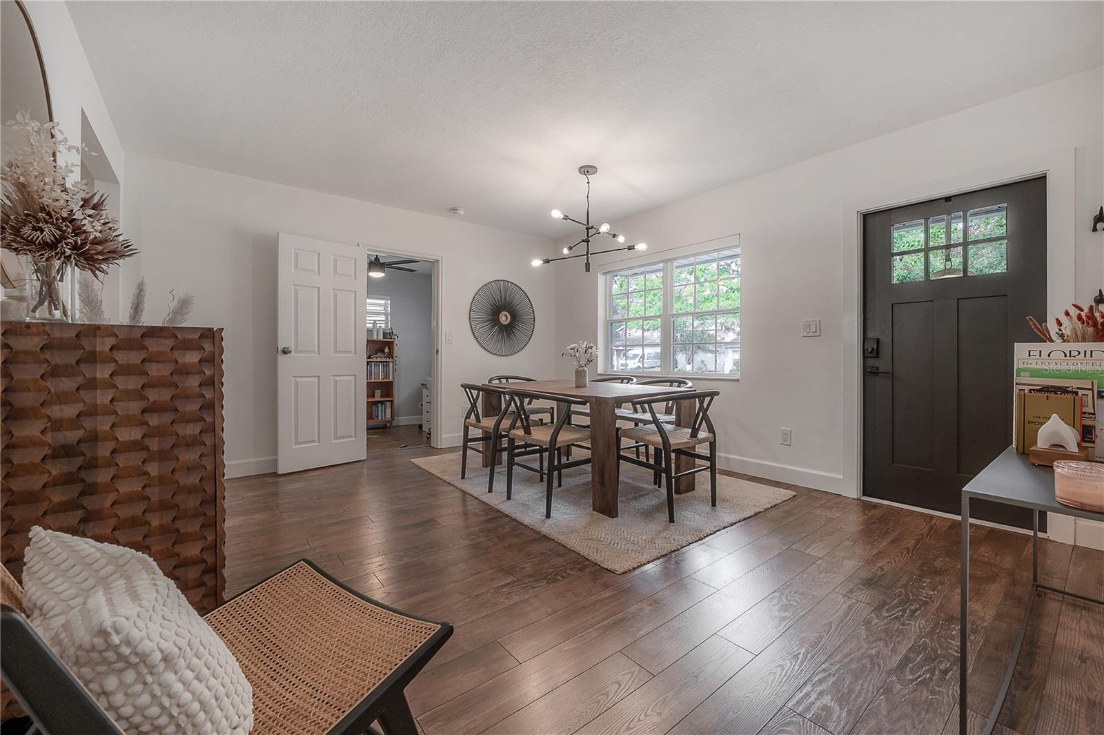 Dining looking to front door and 4th bedrom/office