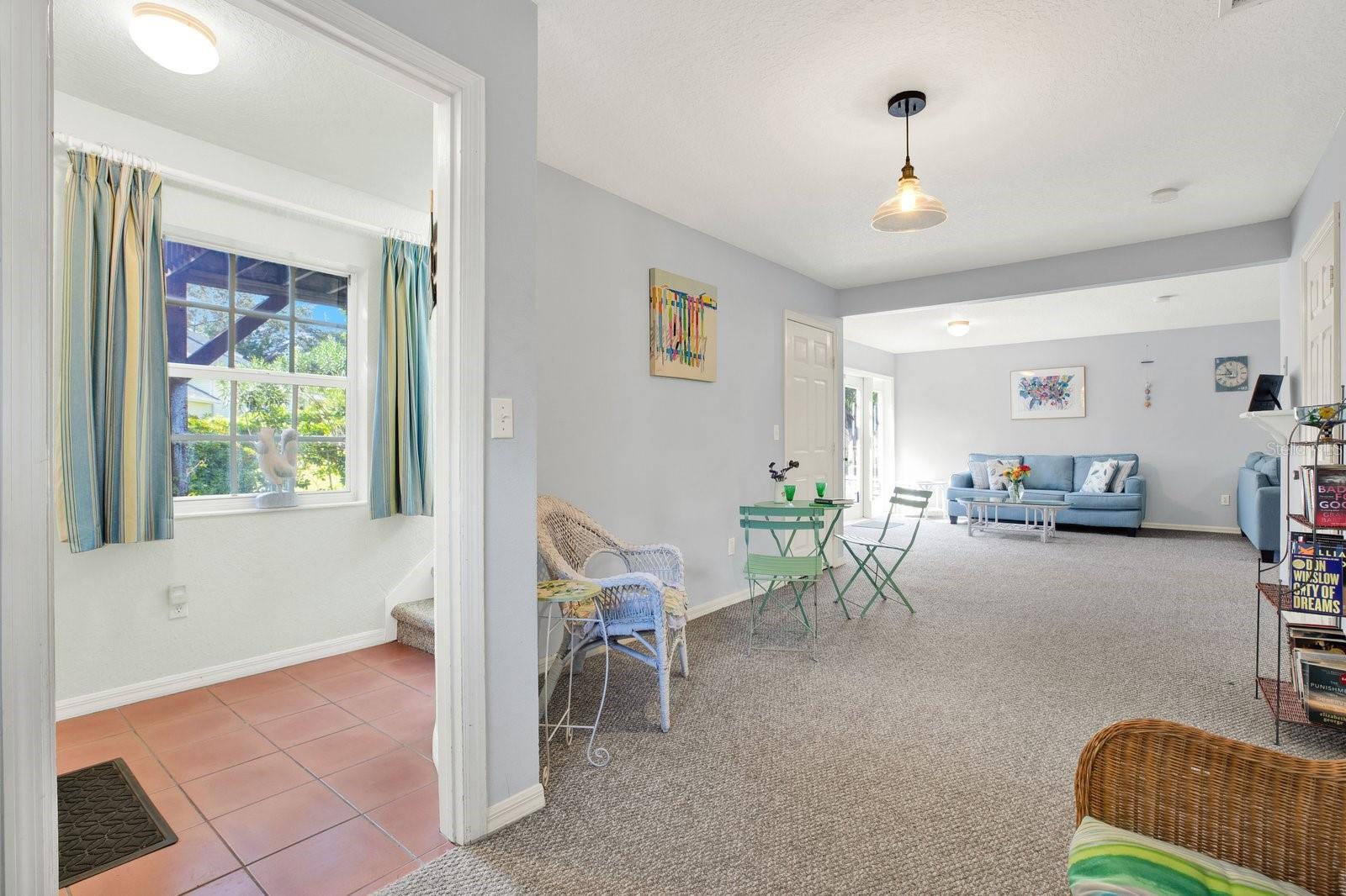 Foyer to left leads upstairs or toward family room/flex space to the right.