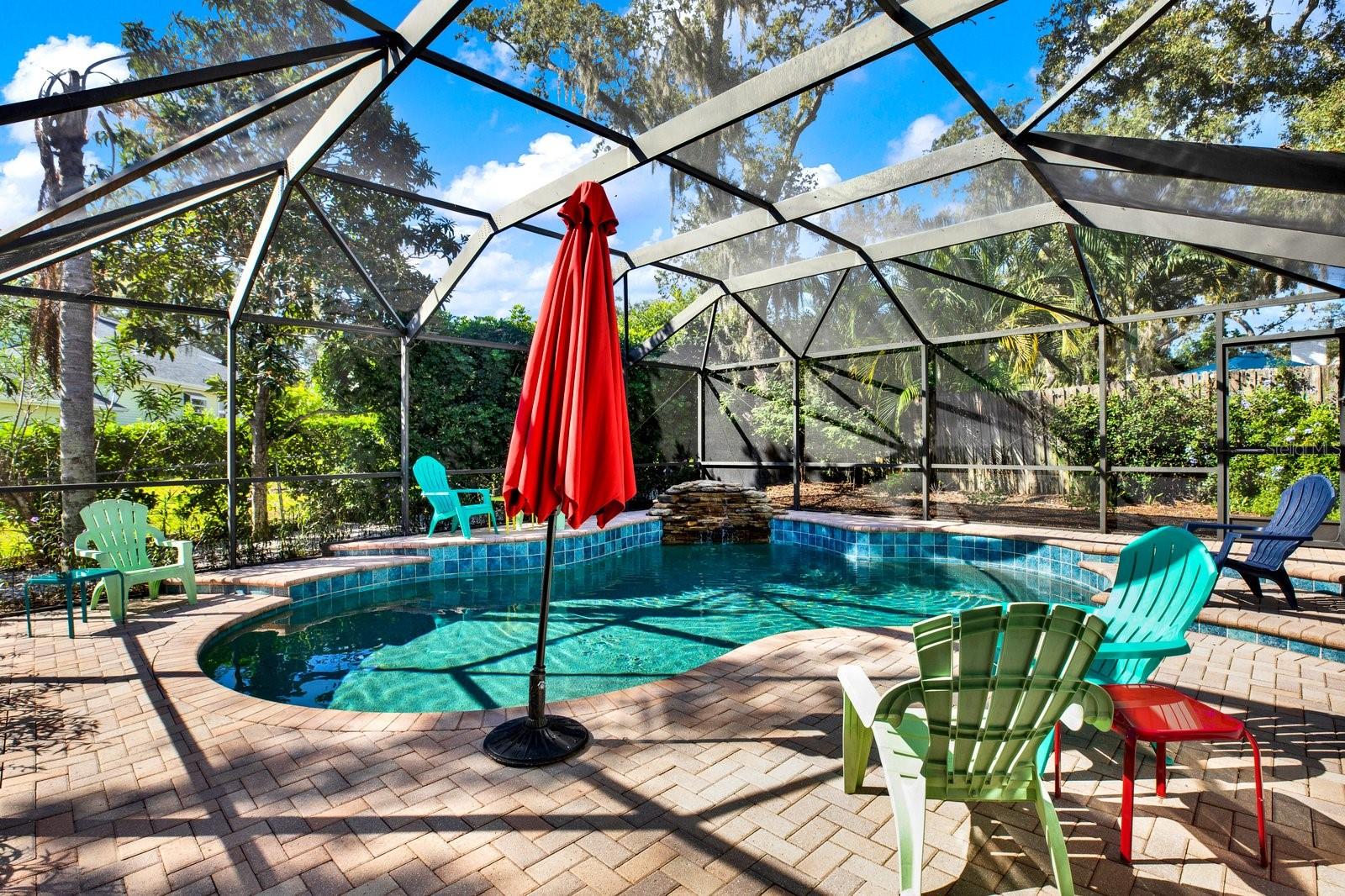 Free-form, PebbleTec finish with water feature.