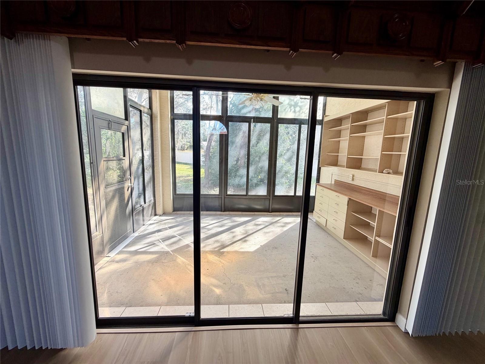 Triple Sliding Glass Doors Porch with Built in Shelves