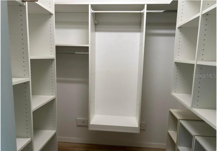 Master bed room walk in with Built in Shelves