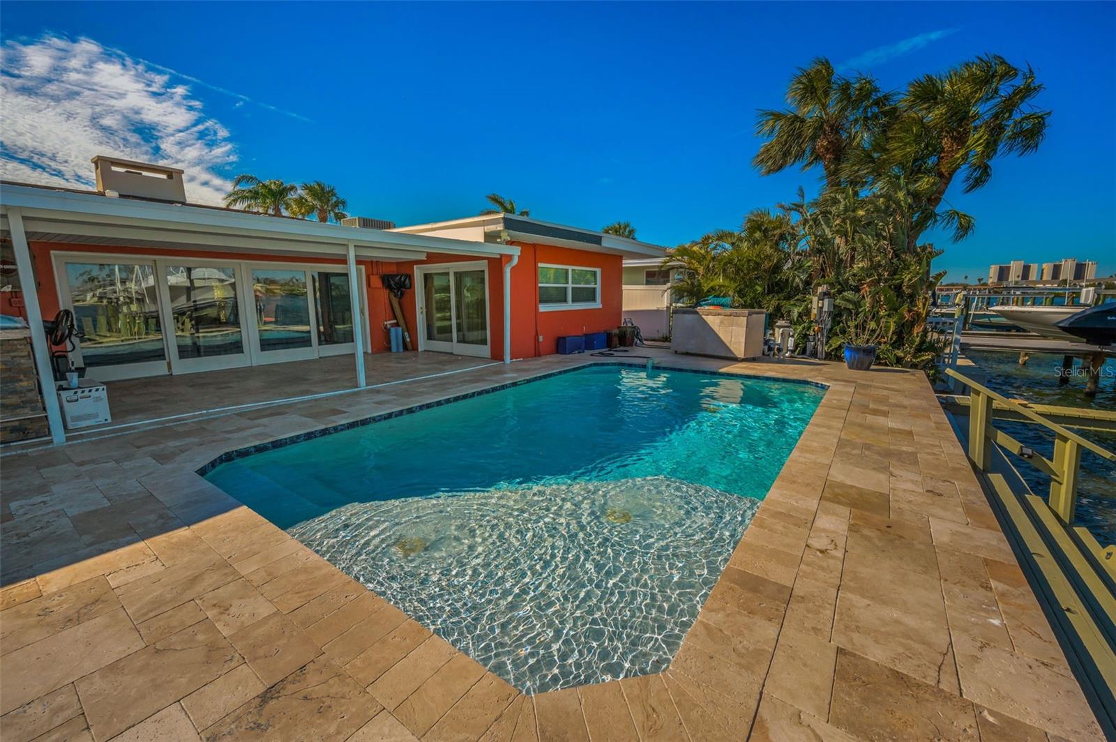 Wonderful paver patio and heated inground pool on the waterfront!