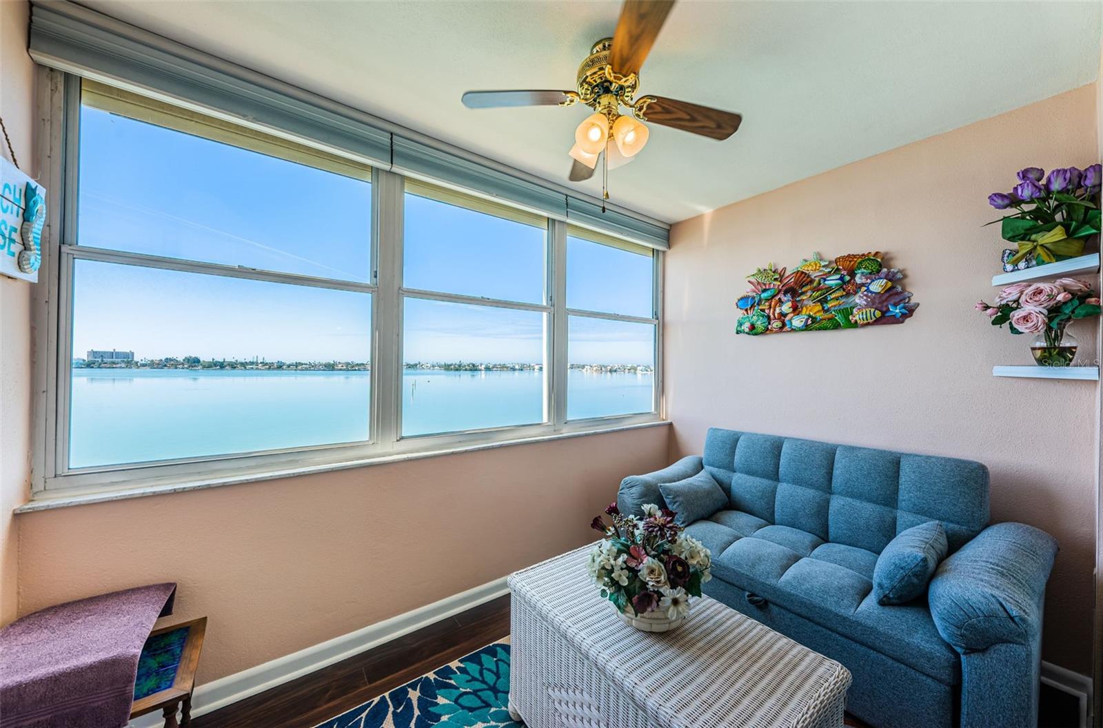 Florida room with Laminate flooring, solar blinds and HURRICANE shutters.