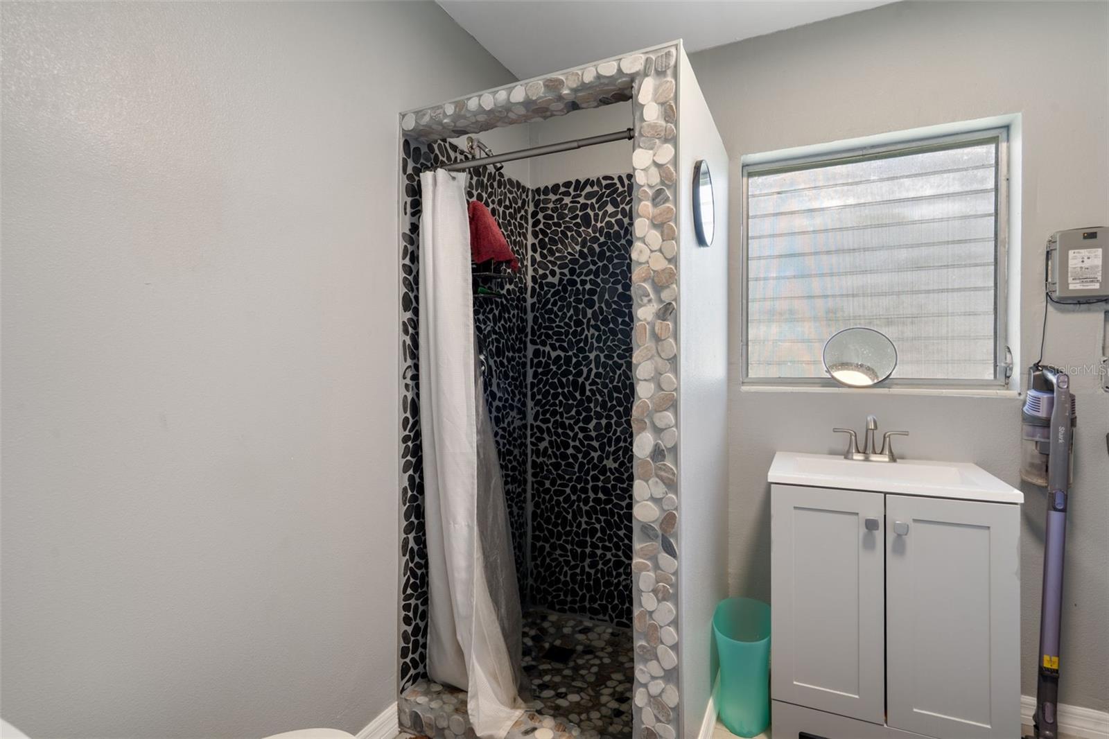 2nd Bath is in Garage area along with the Laundry in same room. Heated and cooled space