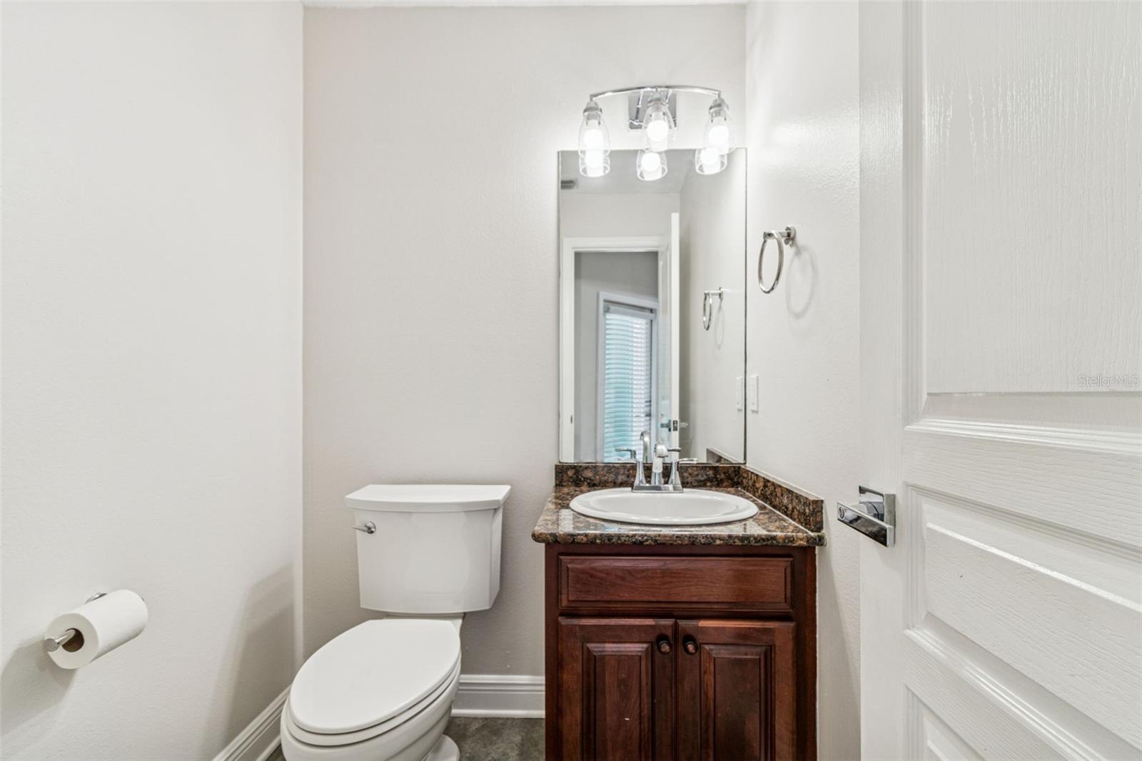 Half bath off kitchen to pool.