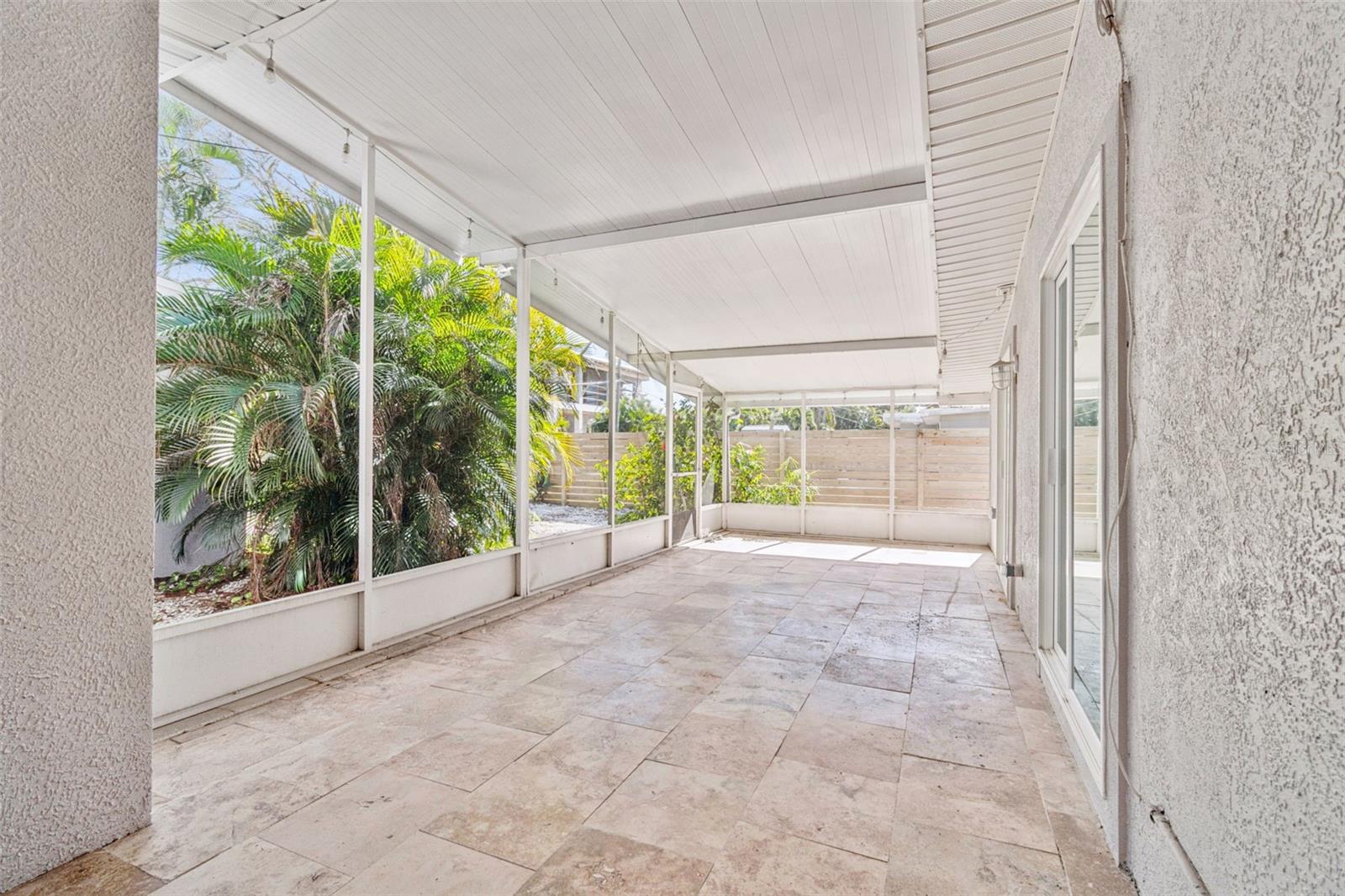 Screened in patio with travertine floors