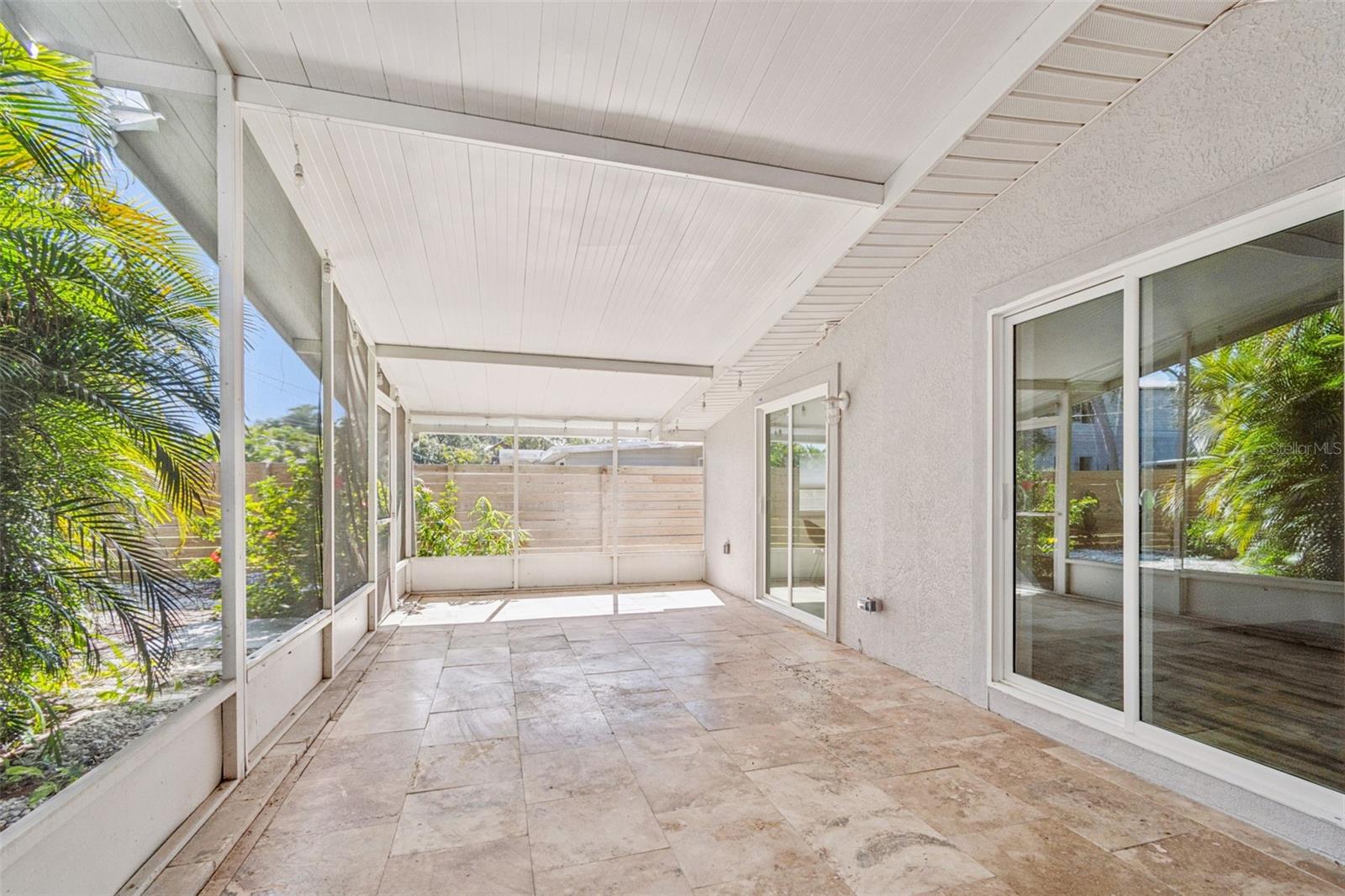 Screened in patio with travertine floors