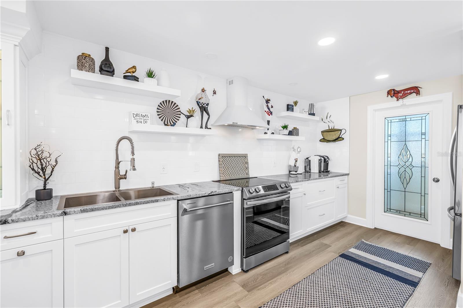 Kitchen with Glass Door to Pantry and Laundry Room