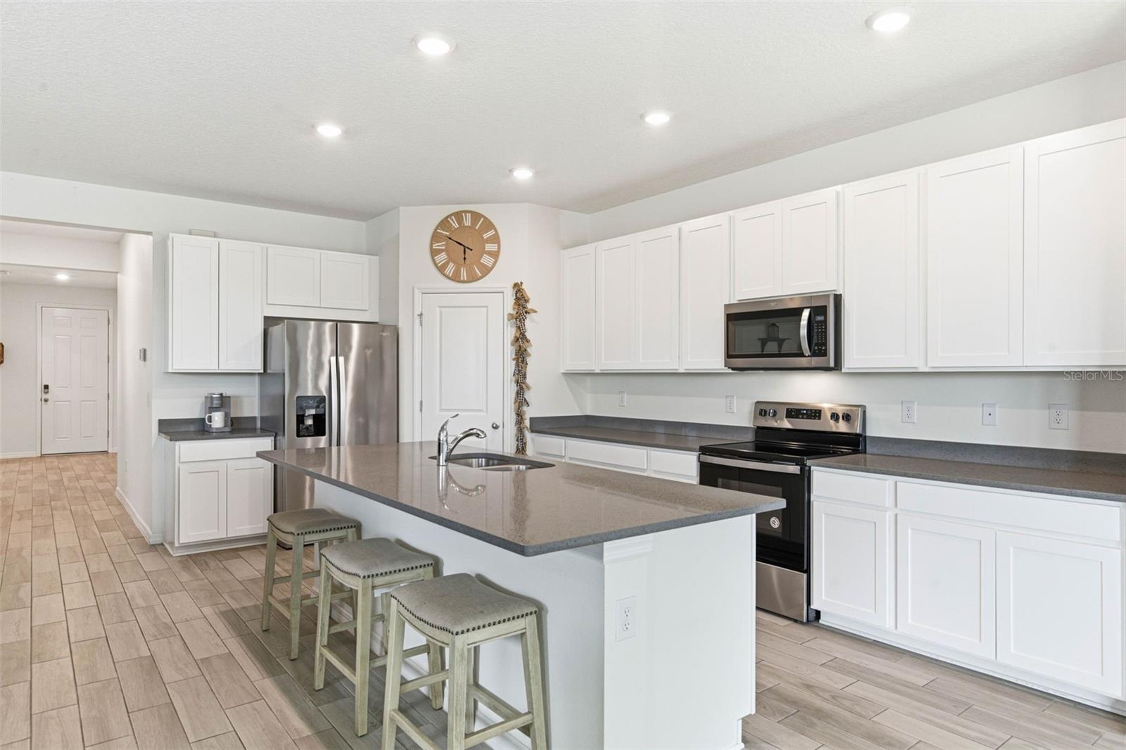 Massive Kitchen with nice breakfast bar and cabinet space every bakers and chefs dream