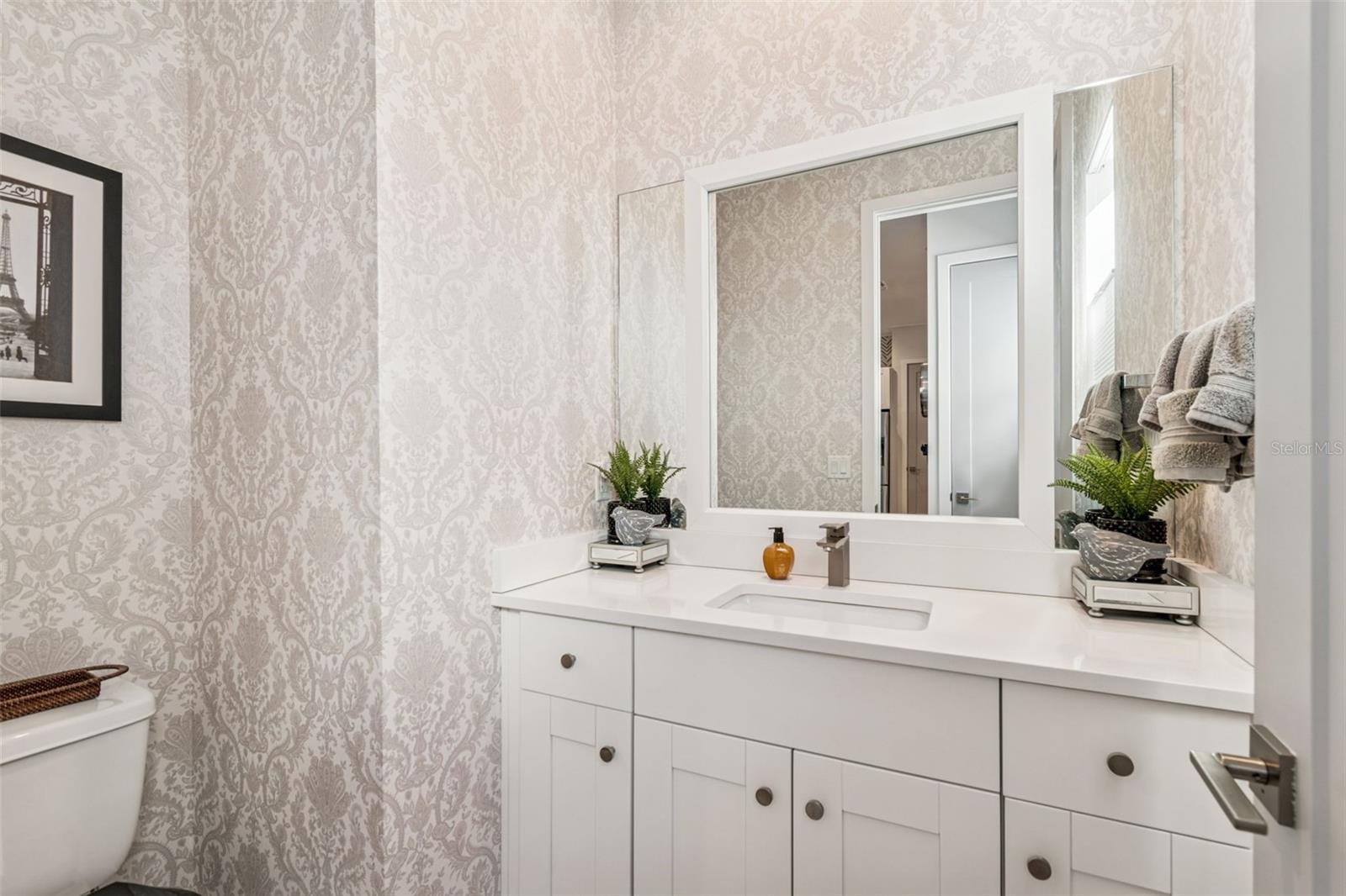 level 2 half bathroom next to kitchen