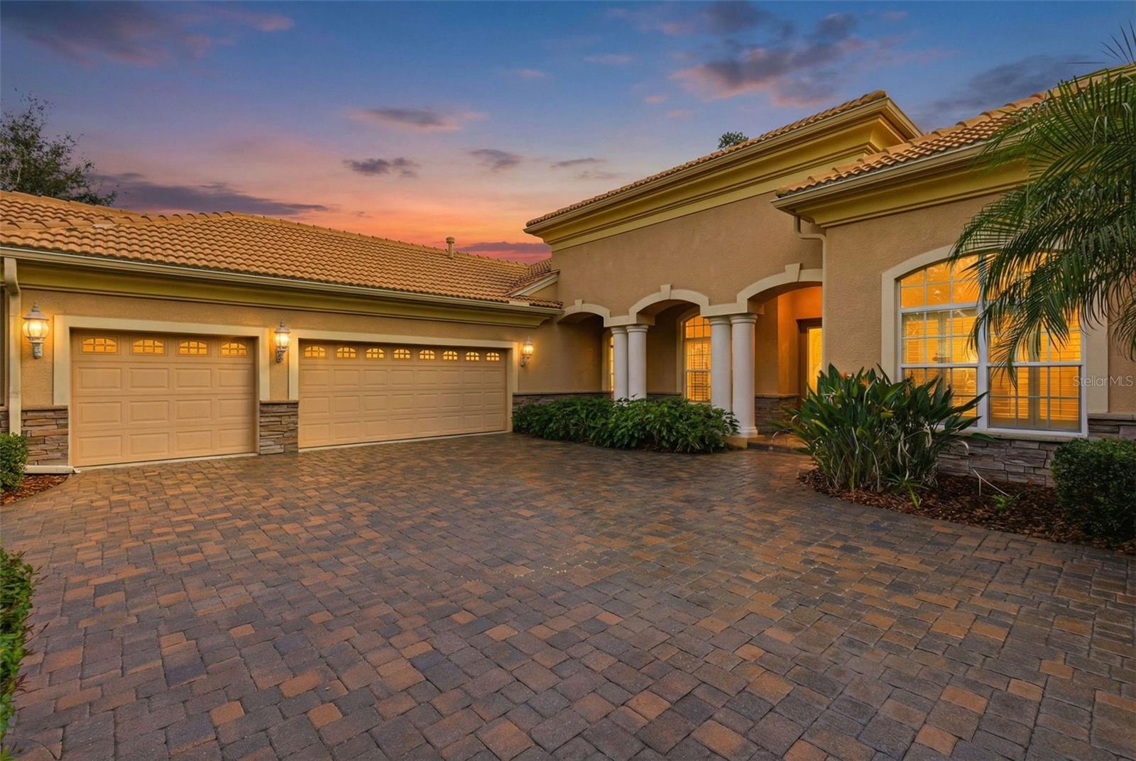 Lovely pavers, clay tile roof, 3 car garage