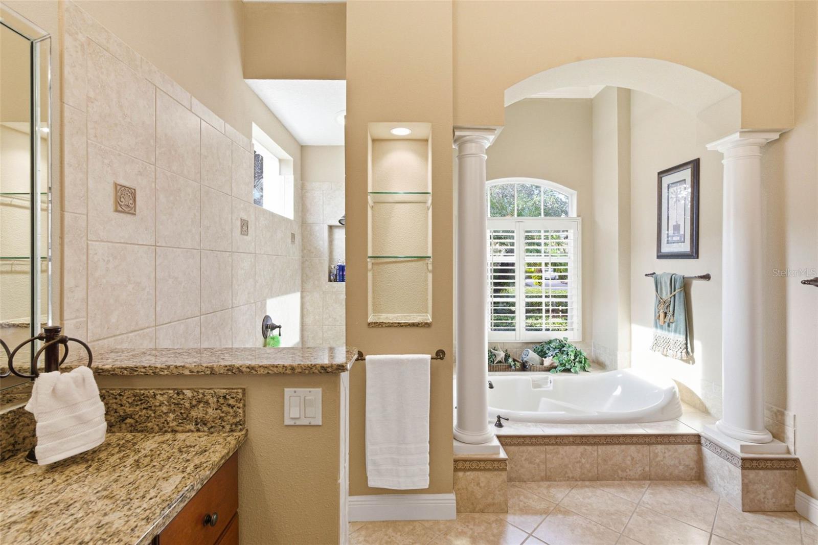 Primary bath with deep soaking tub and separate shower