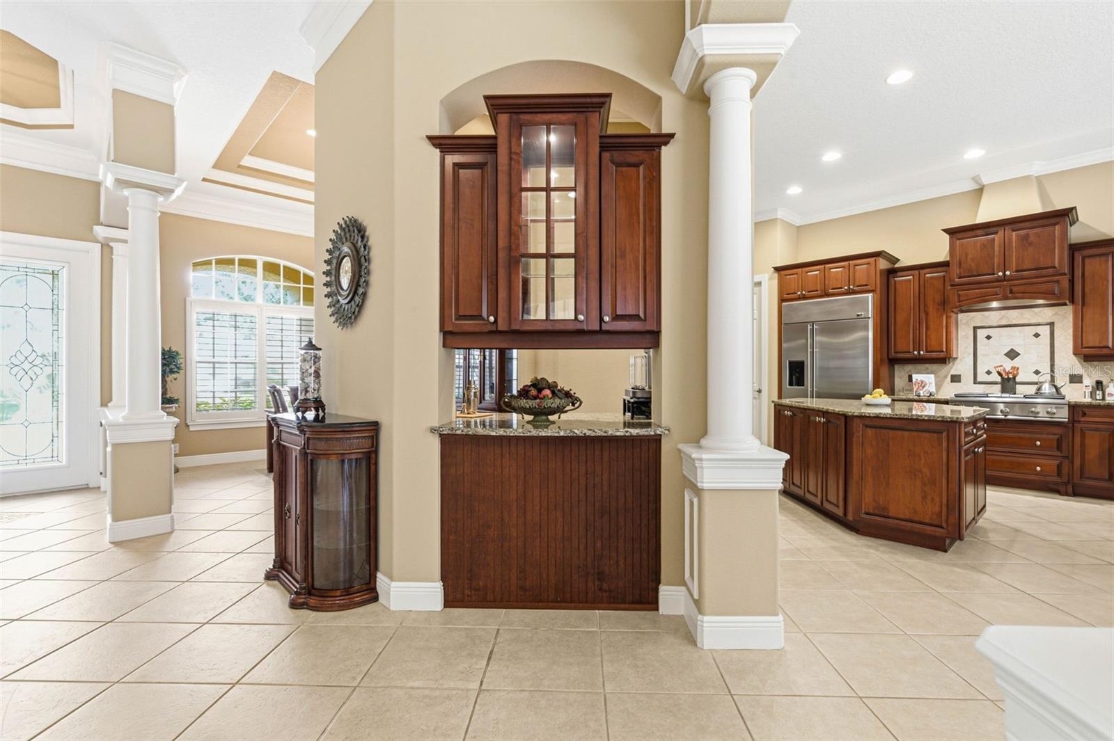 View of foyer, dining room, kitchen
