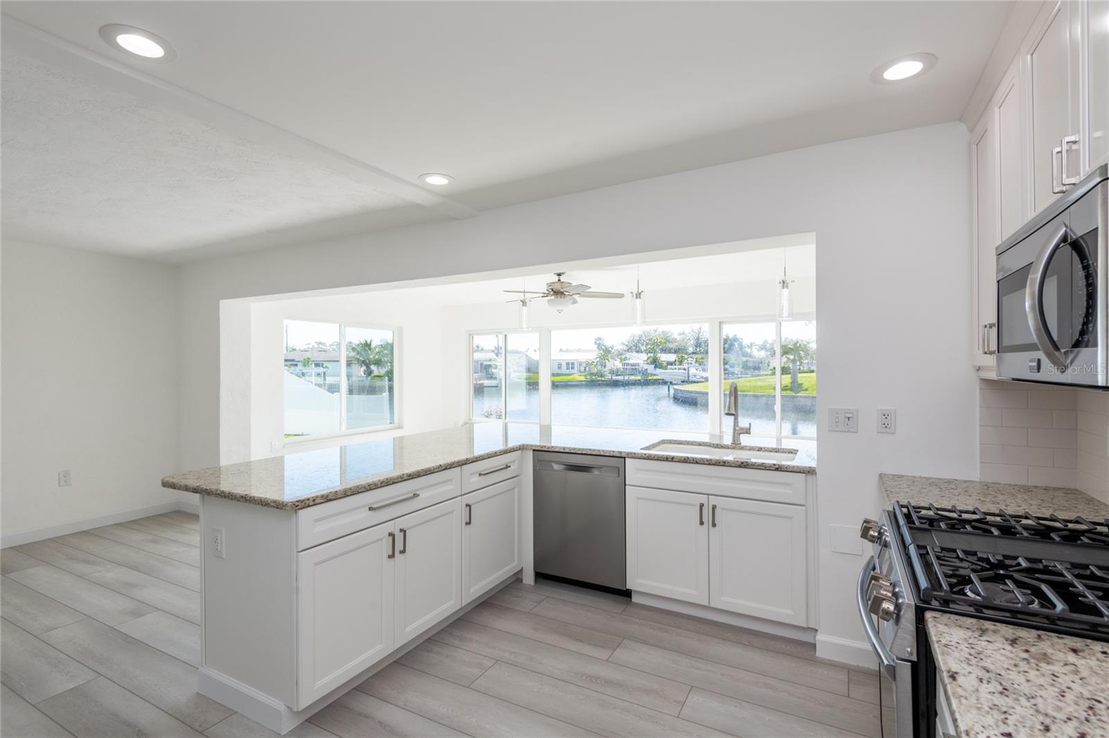 Kitchen opens to the family room overlooking the water