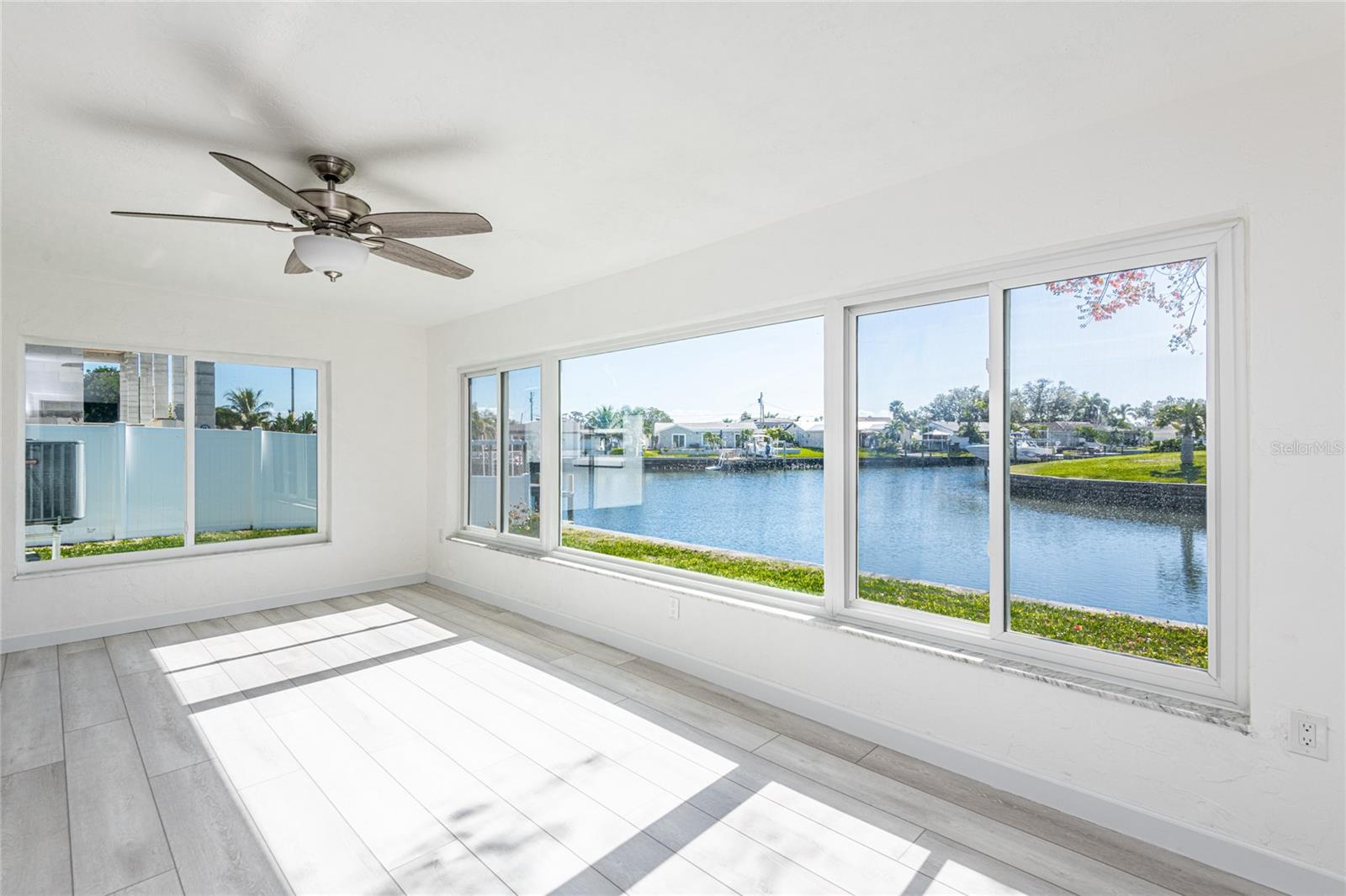 Light and bright family room overlooking the back yard and canal