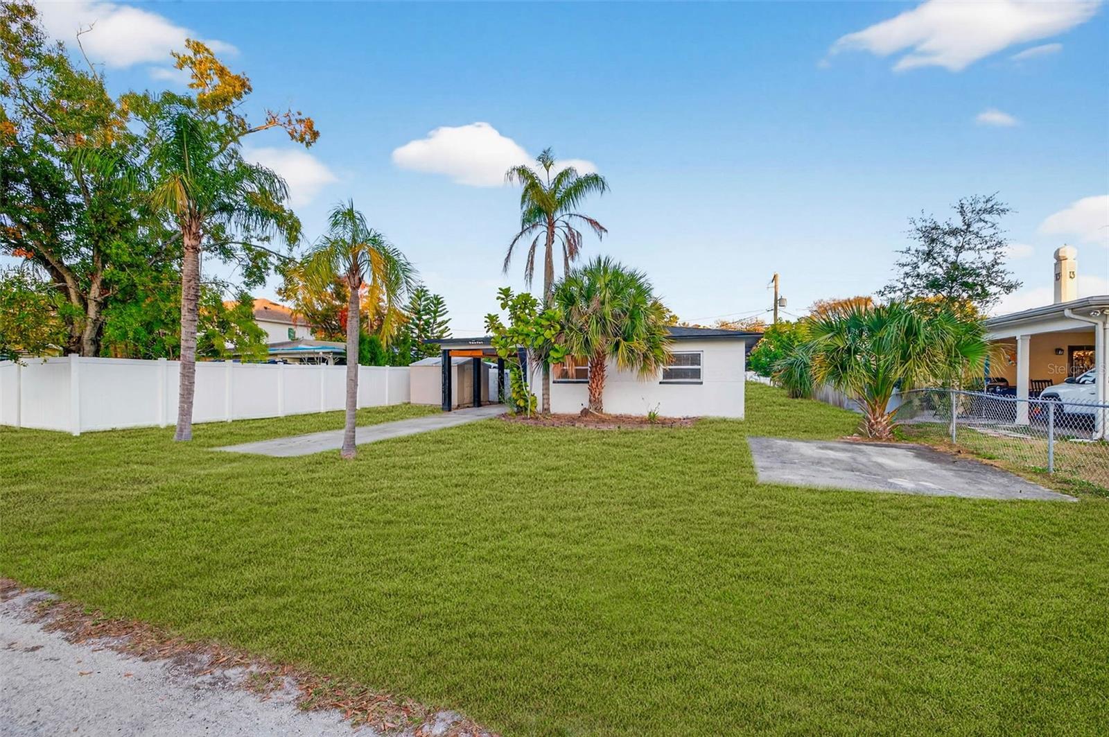 Back side of the house off Gunlock ave. Lawn shown has been digitally enhanced to illustrate potential landscaping