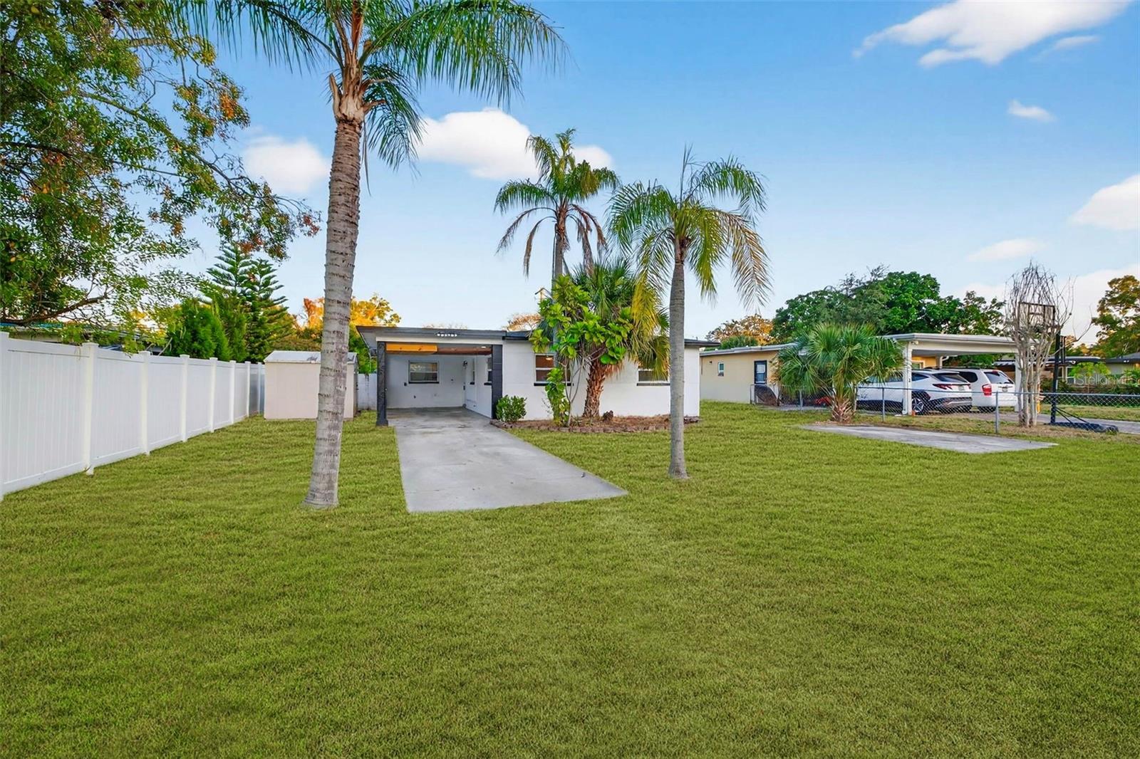 Back side of the house off Gunlock ave. Lawn shown has been digitally enhanced to illustrate potential landscaping