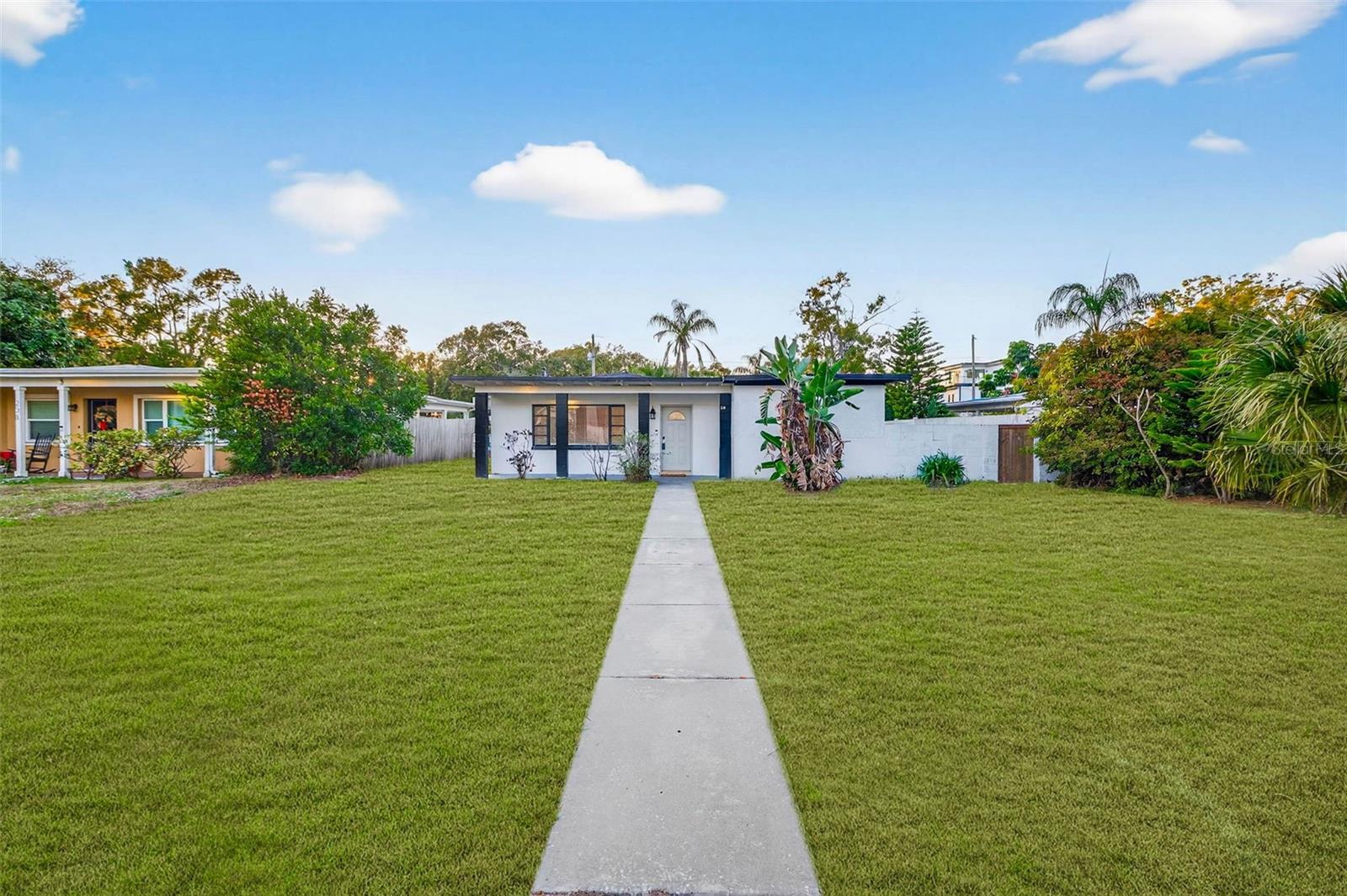 Front yard off N Glen Ave. Lawn shown has been digitally enhanced to illustrate potential landscaping