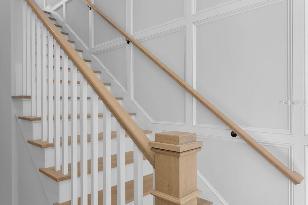 CUSTOM PANELING HIGHLIGHTS THECUSTOM CRAFTED STAIRCASE