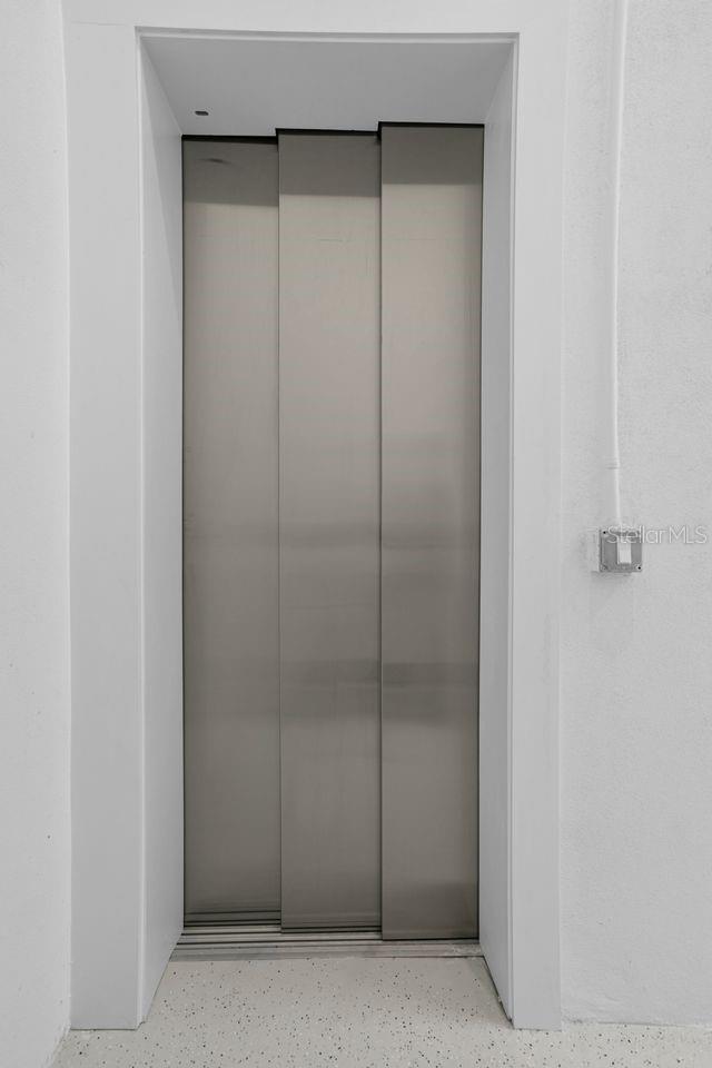 INDUSTRIAL ELEVATOR FROM THE GARAGE THROUGH ALL FLOORS... MAKES HAULING GROCERIES A BREEZE