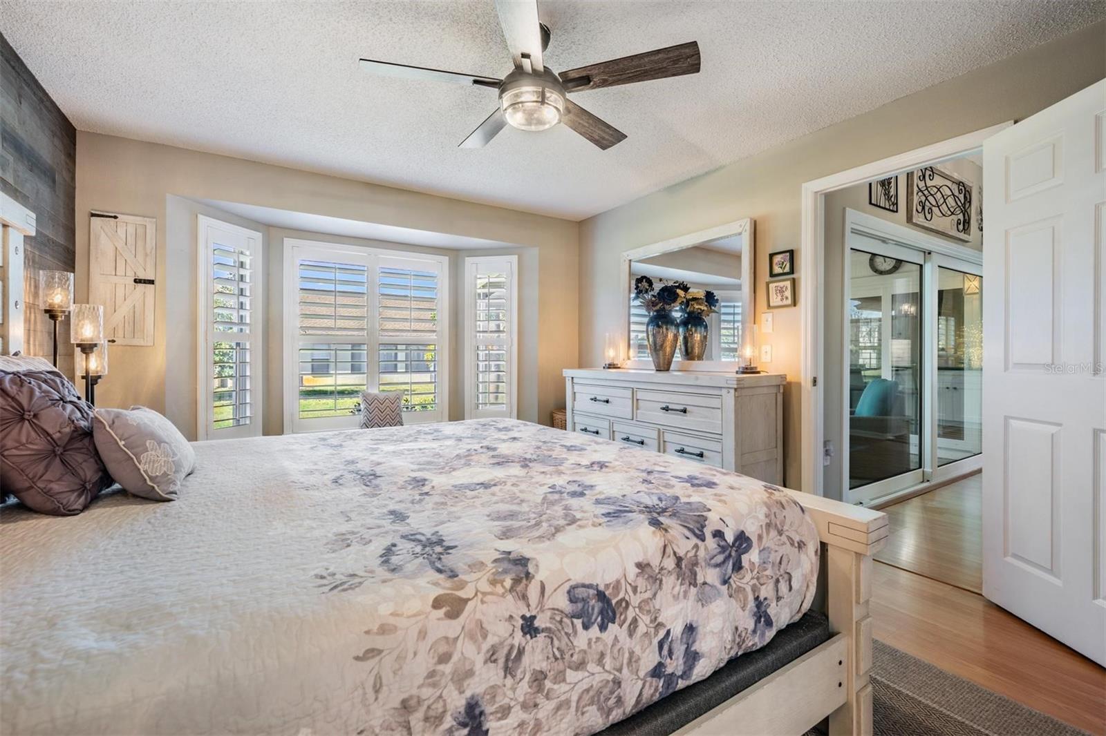Primary bedroom with bay window seating