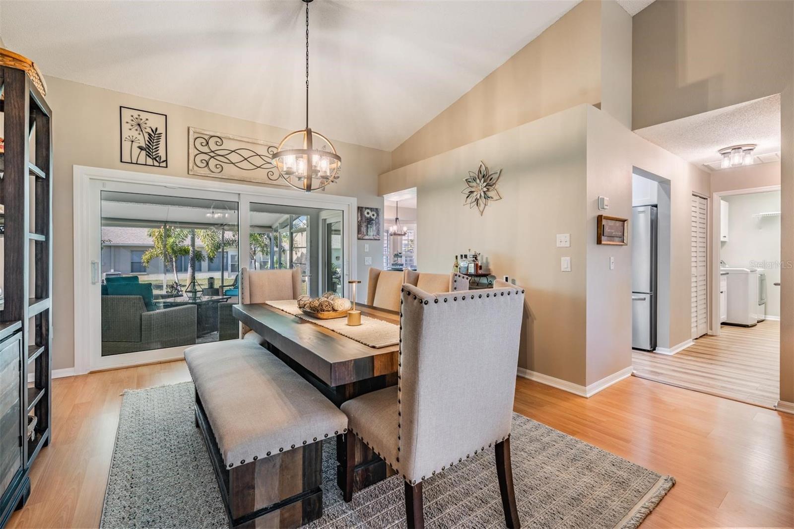 Oversize sliding glass door with a lanai view