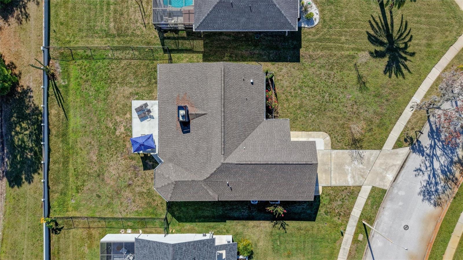 Aerial view showing the large fenced back yard