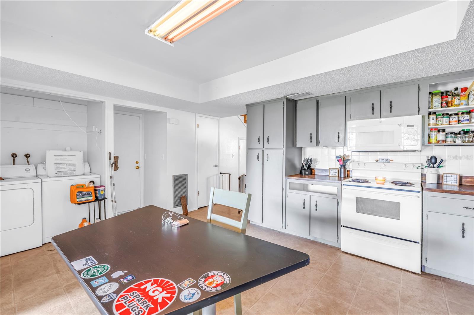 Kitchen with indoor laundry