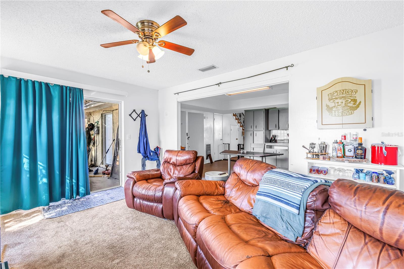 Family room has sliders to the outdoor patio