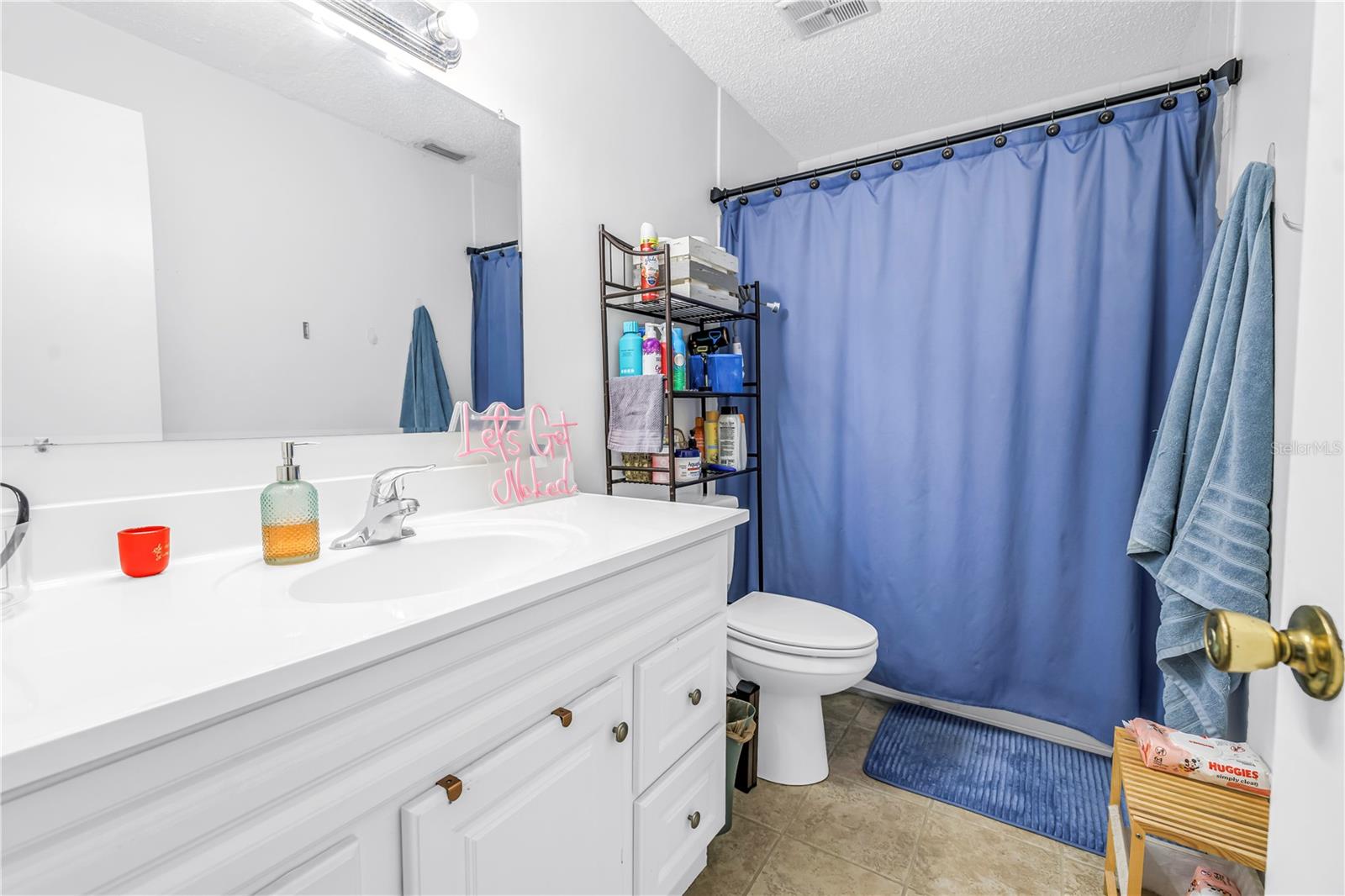 Full bathroom upstairs with tub shower & newer vanity