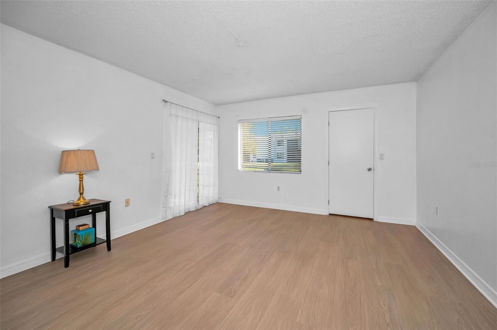 Primary bedroom with slider to lanai