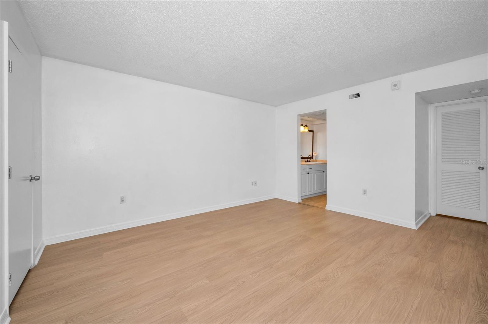 Primary bedroom with THREE walk-in closets