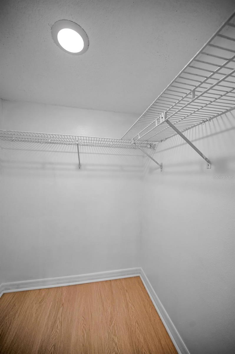 One of THREE walk-in closets in primary bedroom