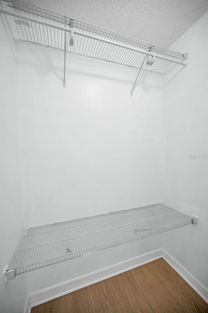 One of THREE walk-in closets in primary bedroom