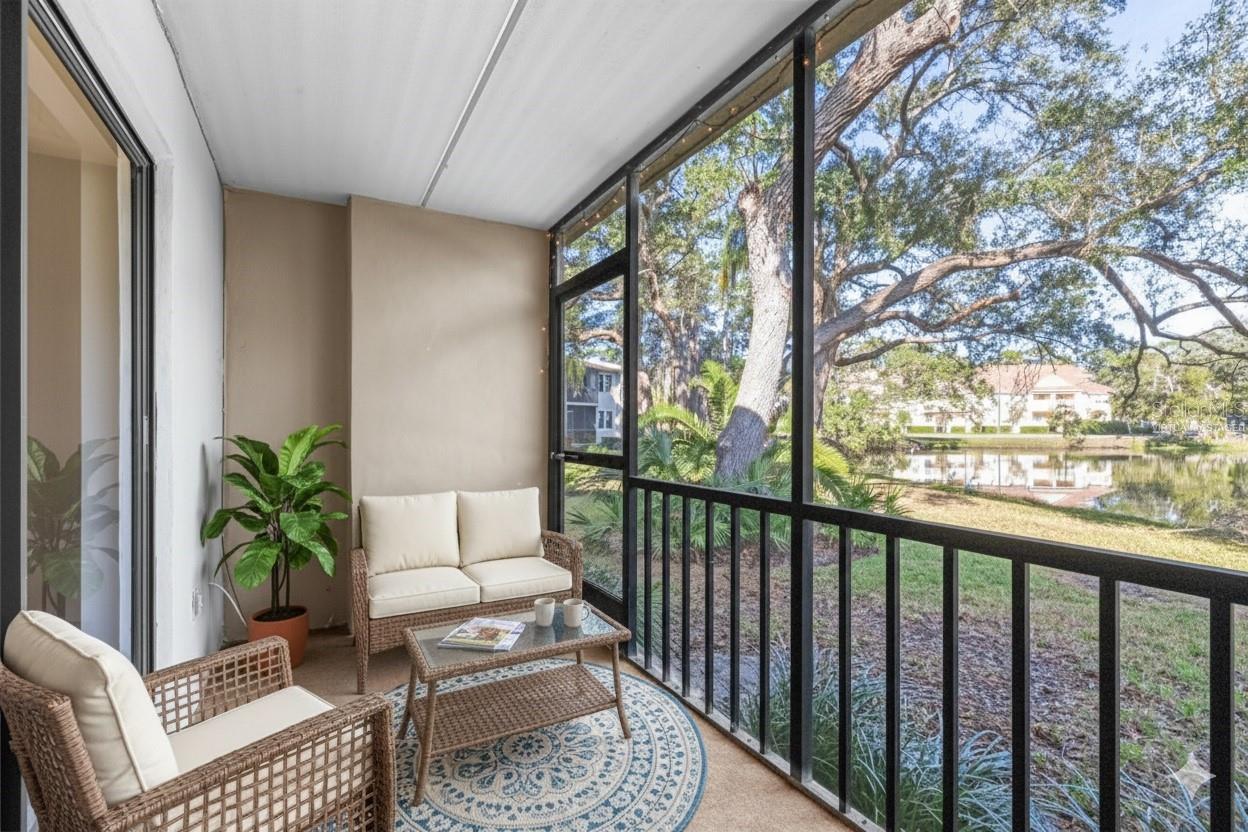 virtually staged back patio overlooking water