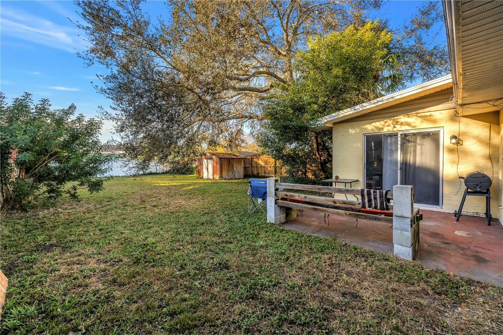Fenced backyard with patio & shed storage
