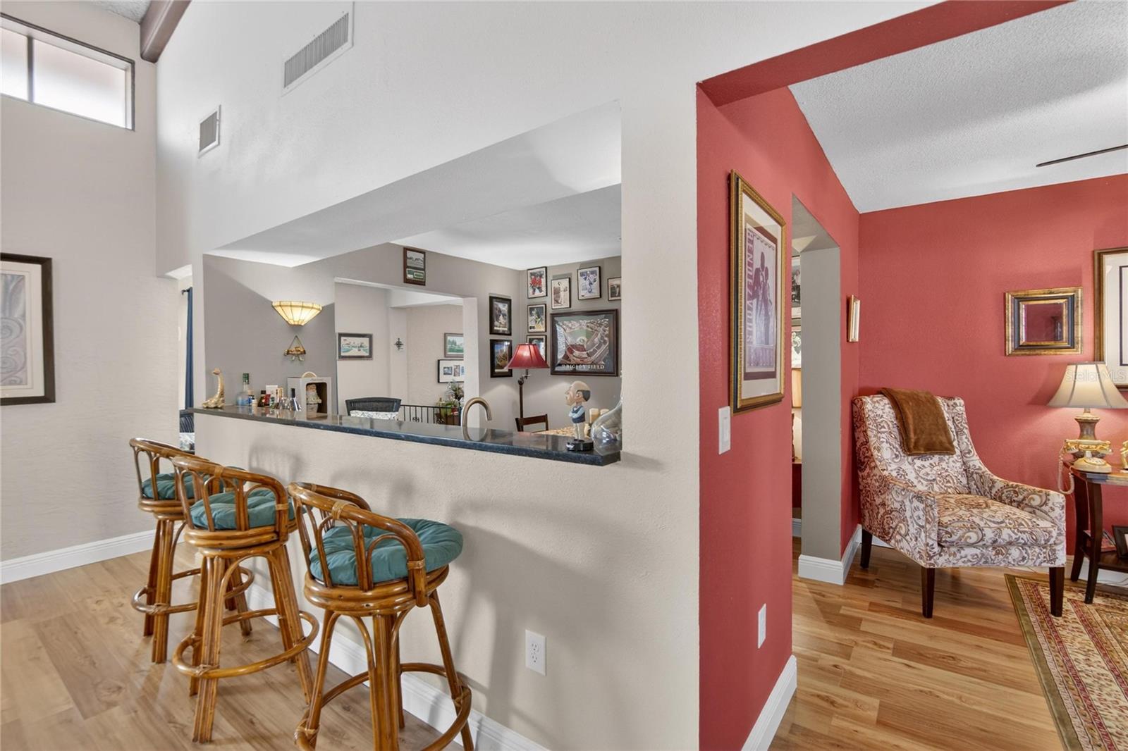 Bar stools by the bar and den space