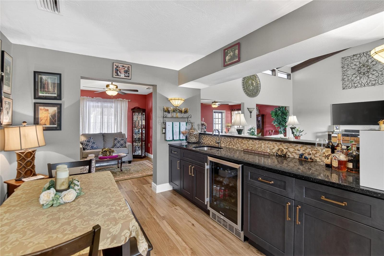 Bar area with beverage fridge and sink