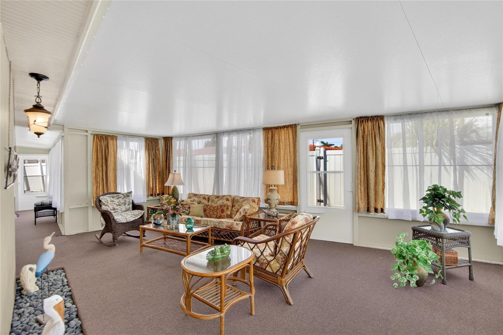 Florida Room with doorway to the back yard