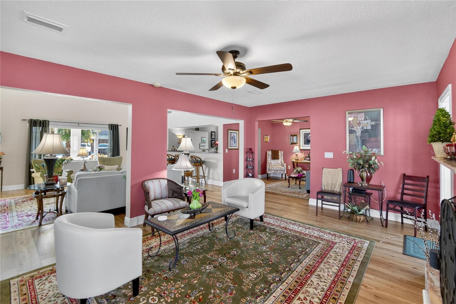 Family Room view looking into the Living Room and den space