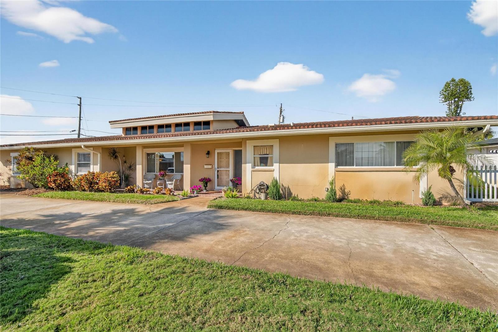 Front elevation of house with circular driveway