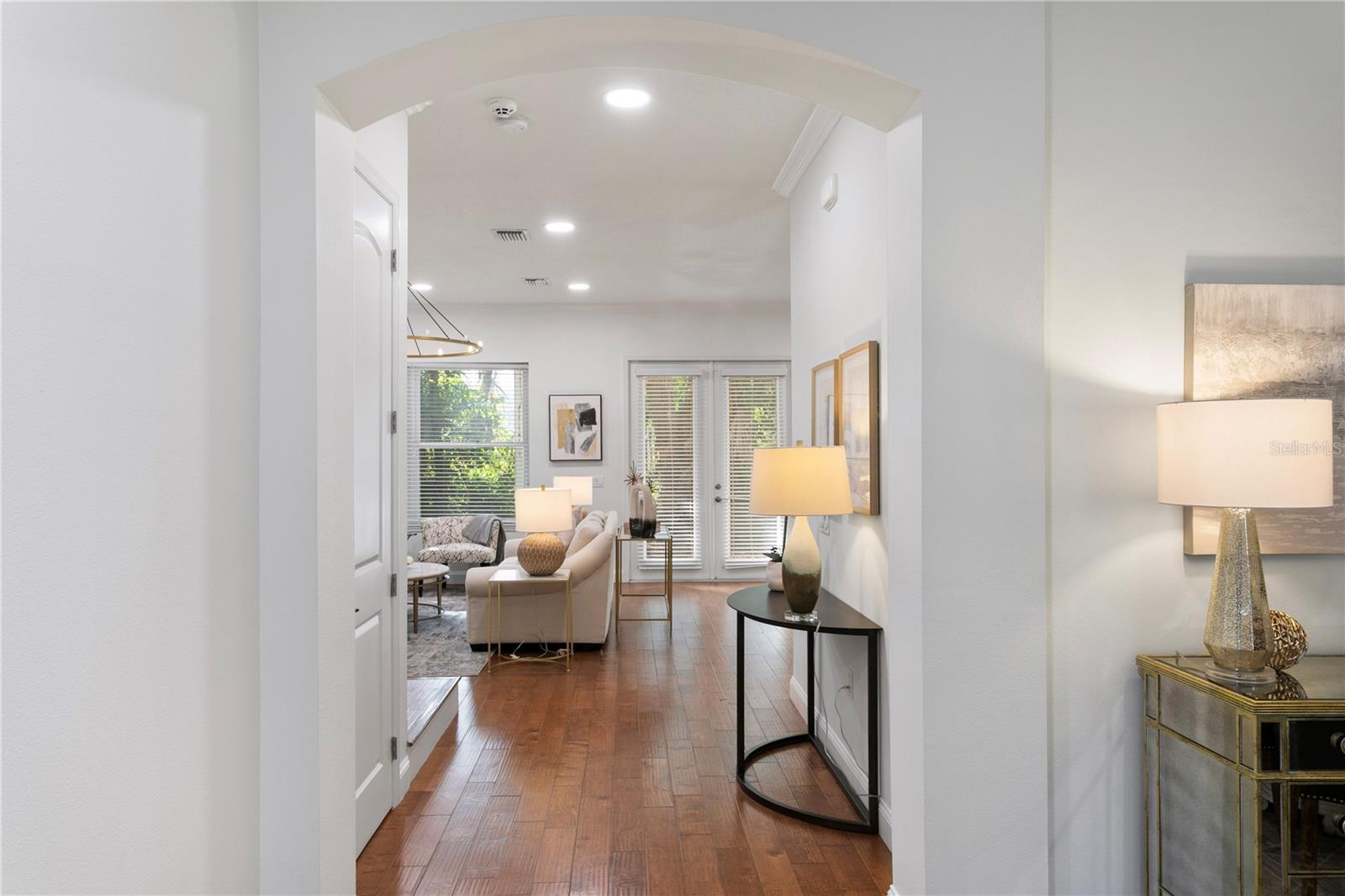 Step into a light-filled interior featuring rich wood flooring throughout—no carpet in sight.