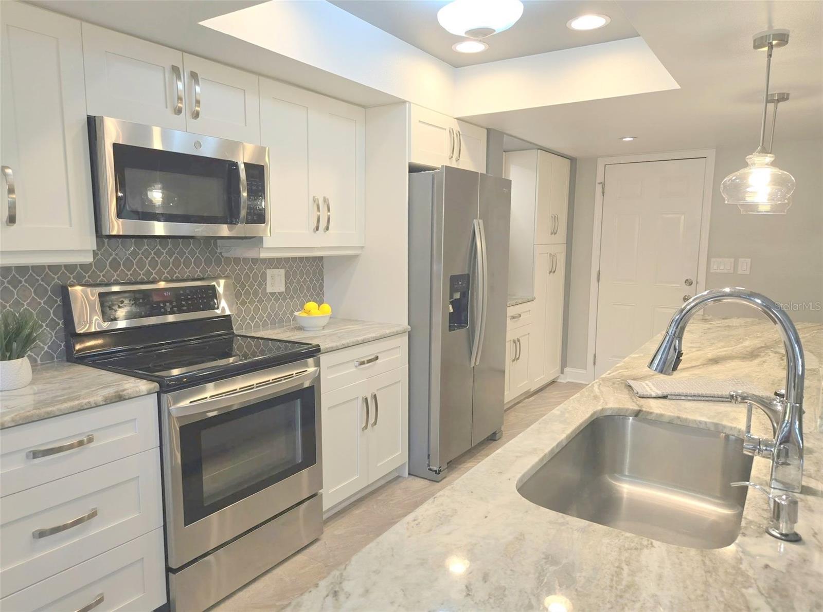 Kitchen remodel & renovation included opening a tray ceiling, new light fixtures & under cabinet lights~